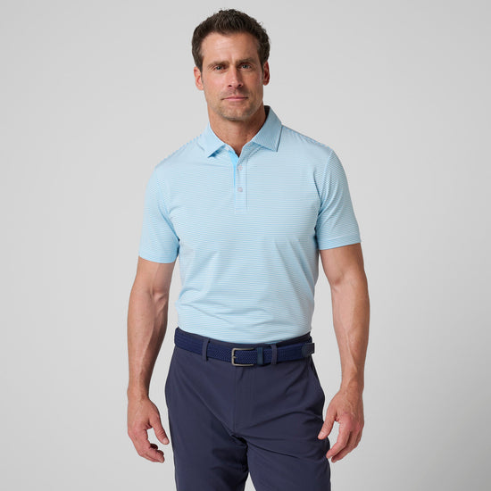 Light blue striped polo shirt with white horizontal stripes and button collar, worn with dark navy pants.