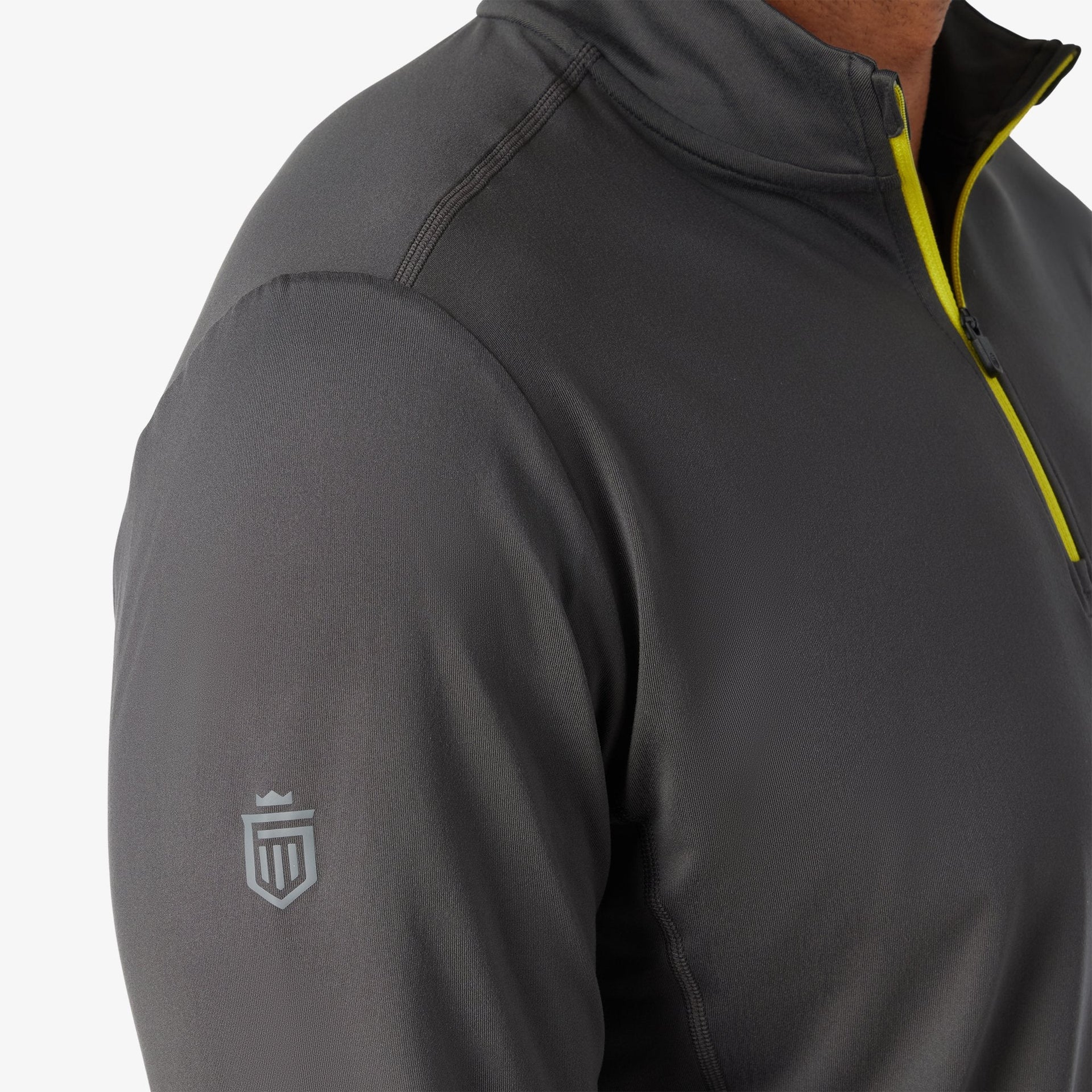 Charcoal quarter-zip pullover with yellow accent trim and embroidered chest logo.