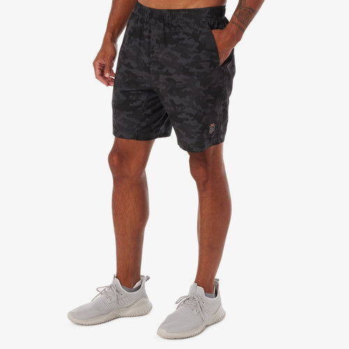 Black camouflage training shorts with elastic waistband and side pockets on male model.