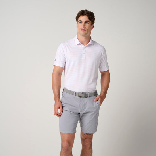 Man wearing light lavender striped mesh polo shirt with collar and gray shorts with belt.