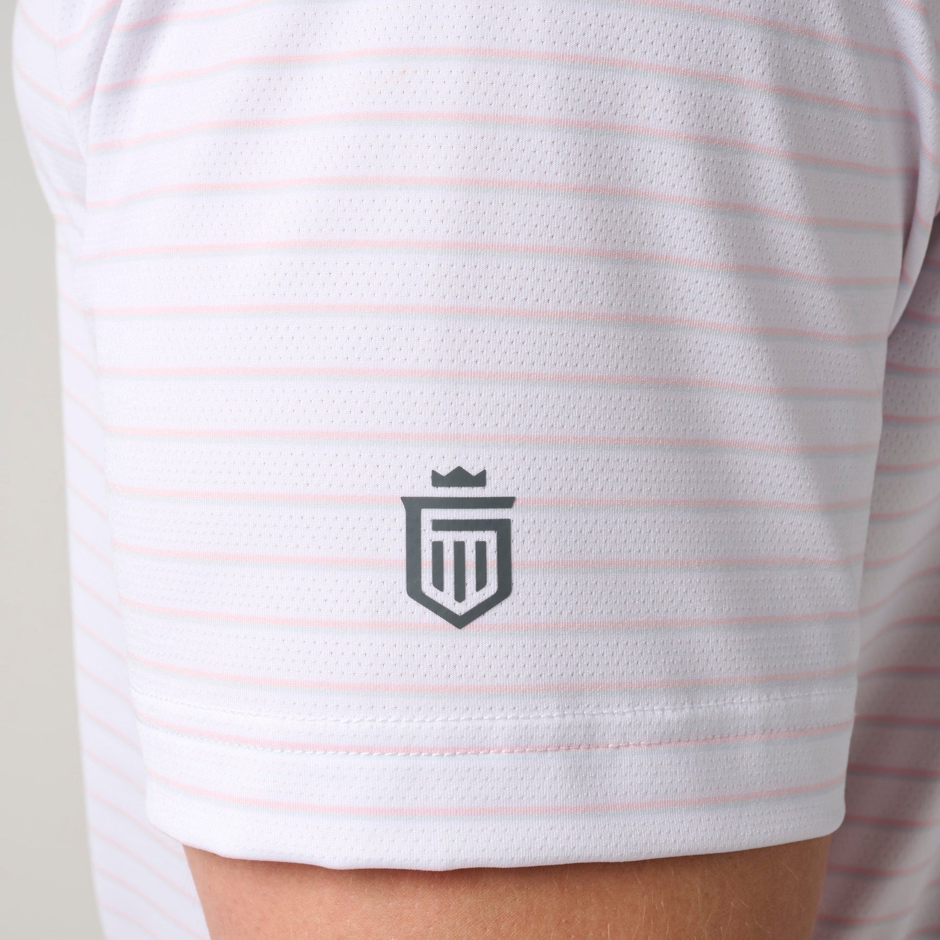 White and pink striped mesh polo shirt with gray crest logo on chest.