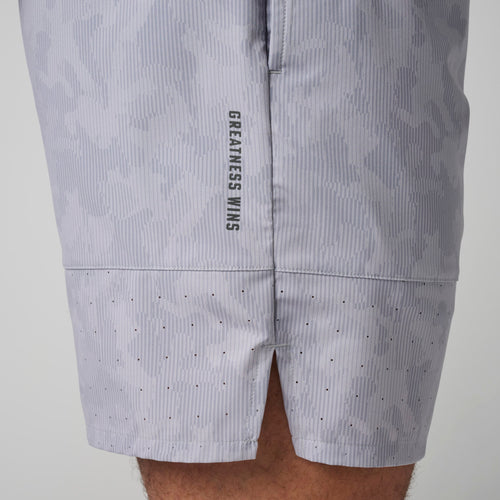 Light gray ribbed training short with perforated ventilation holes and "Greatness Wins" text on thigh.